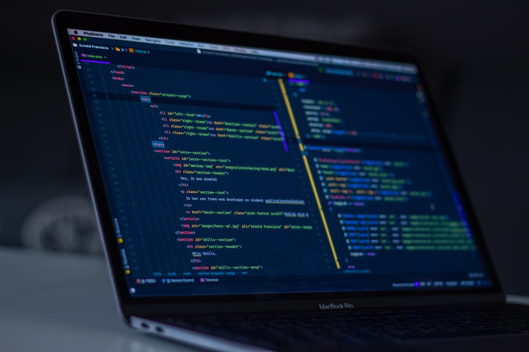 Laptop displaying programming code, illustrating Cursor AI hacking in ransomware operations.