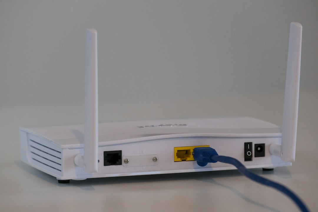 Broadband router with an Ethernet cable, illustrating the Calix router flaw.