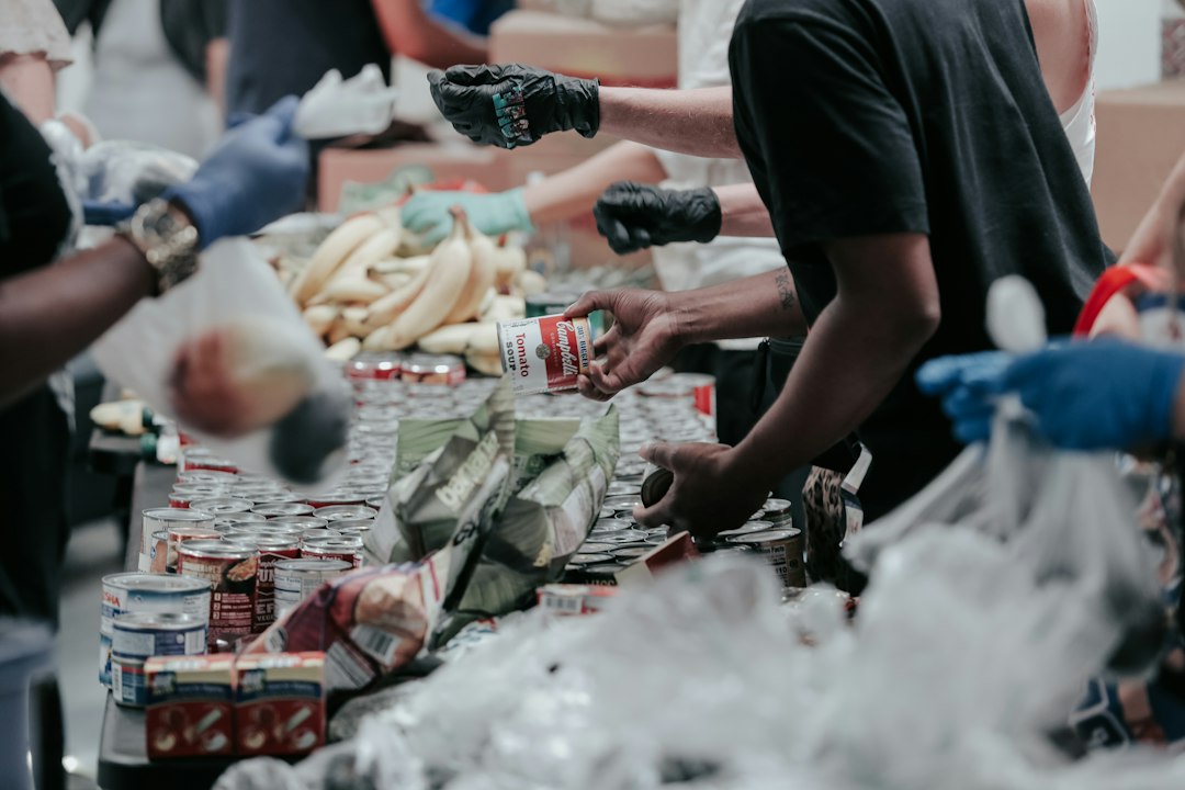 Volunteers sorting food donations, illustrating the GiveWP vulnerability affecting donation sites.