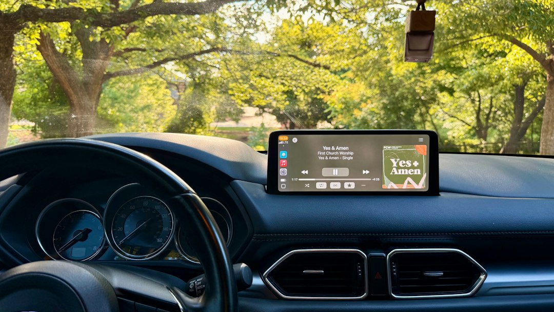 Car infotainment display on a dashboard, illustrating Android car head unit malware.