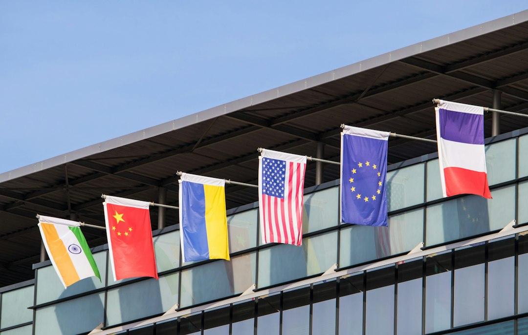 International flags, illustrating proposed AI incident alerts between countries.