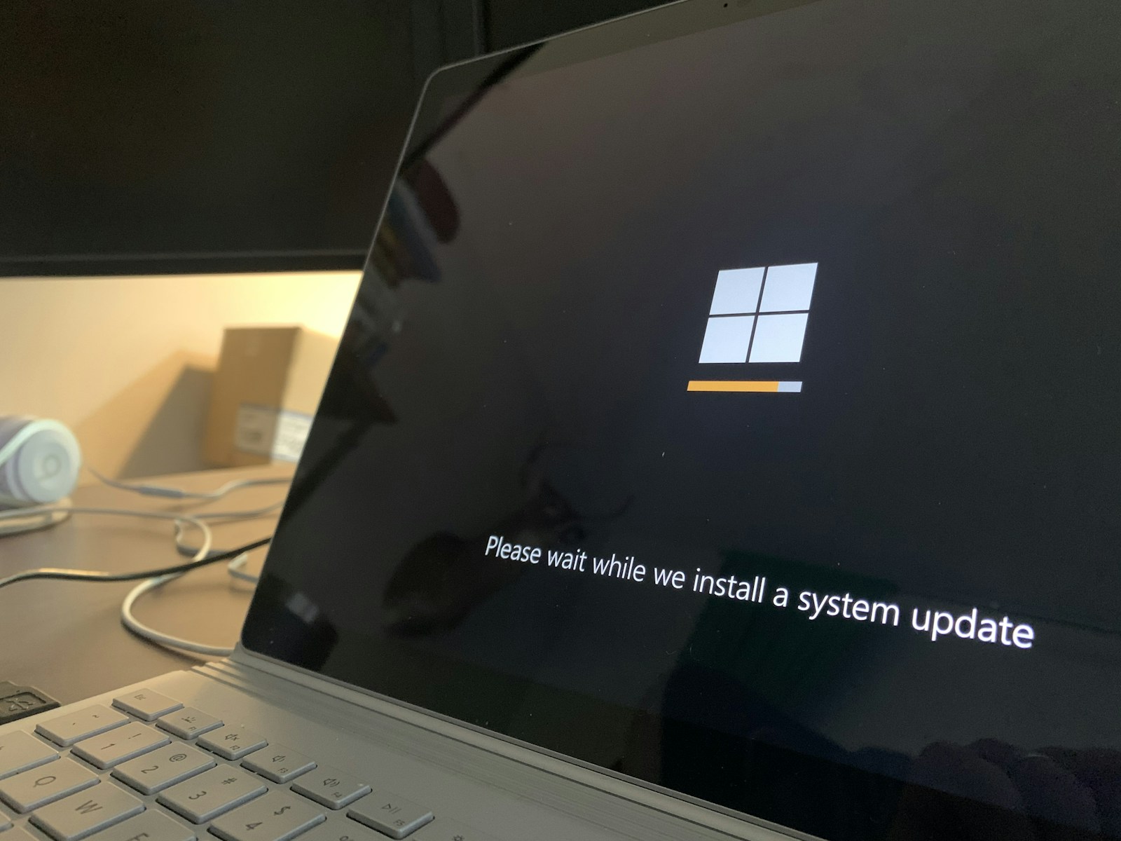 Laptop showing a Windows security update screen.