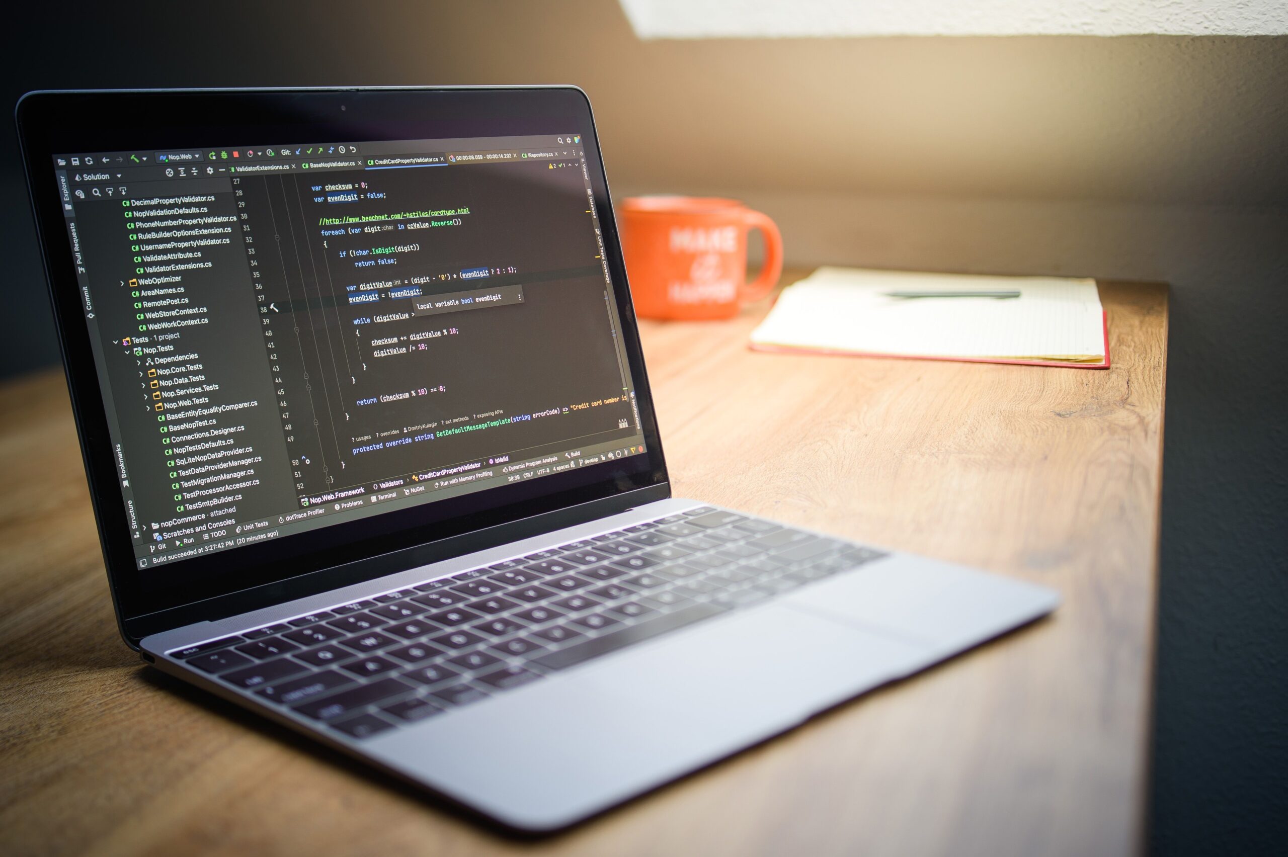 Laptop displaying code, illustrating the PHP session upload progress vulnerability.