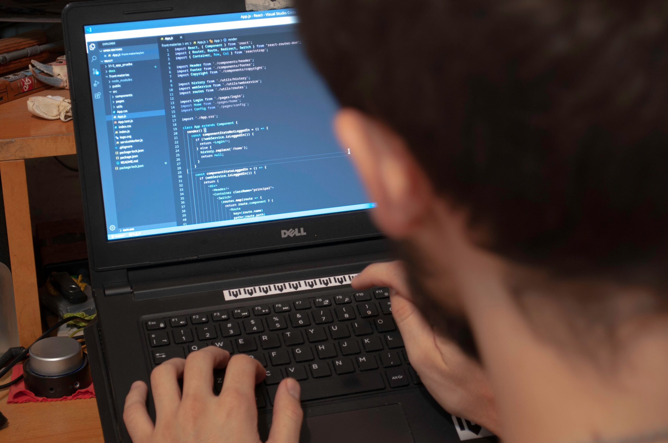 Programmer typing code on a laptop, illustrating AI agent security controls.