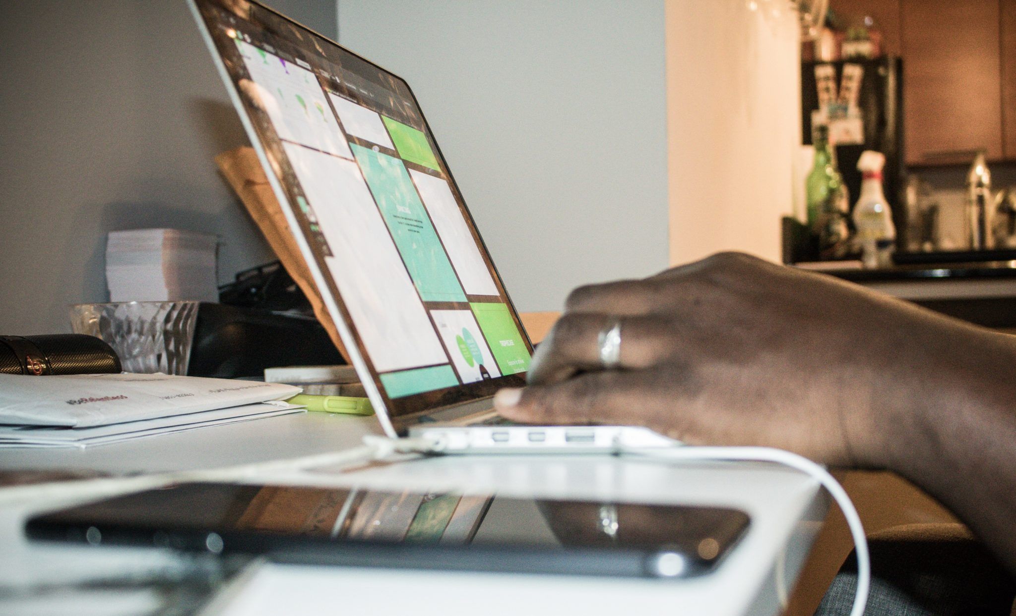 Person using a laptop at home, illustrating AI agent privacy and permission controls.