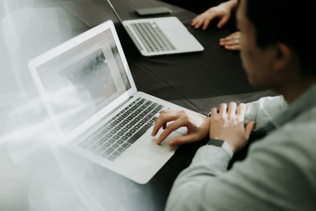 Man working at a laptop, illustrating the FTC AI agent investigation.