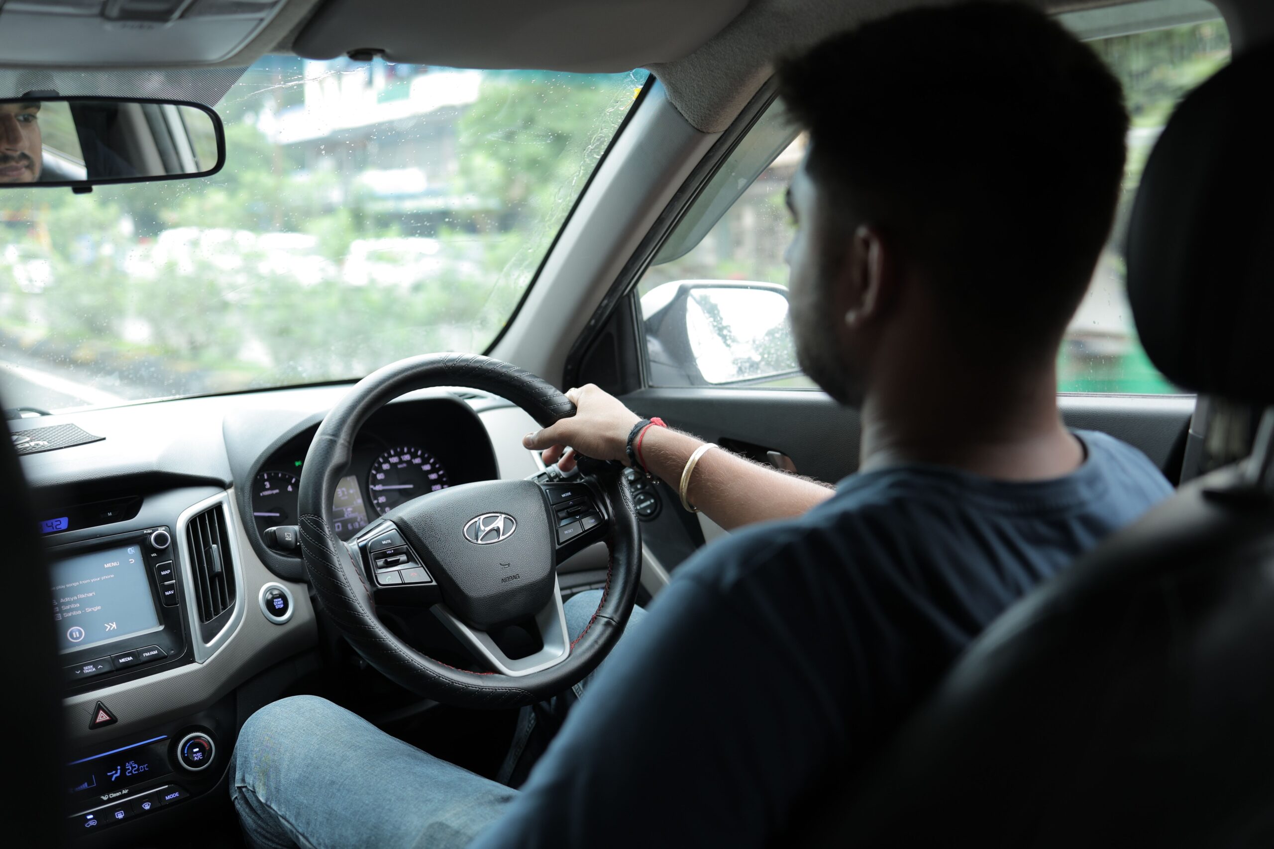Driver at the wheel of a connected car, illustrating connected car privacy.